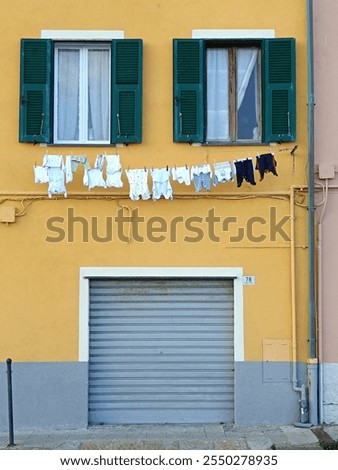 Similar – Image, Stock Photo Façade and two windows of a residential house of the 60s, ochre yellow and pink in geometric representation