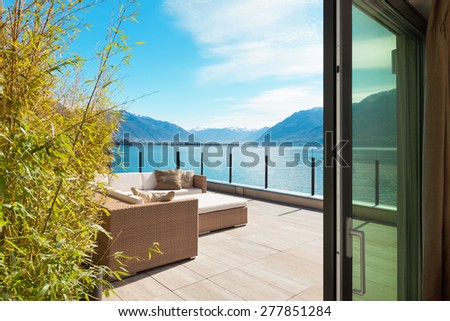 modern architecture, beautiful lake view from the terrace of a penthouse