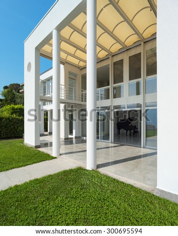 Architecture, white modern villa, view from the garden