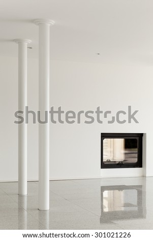 modern house, empty room with pillar and fireplace, white walls