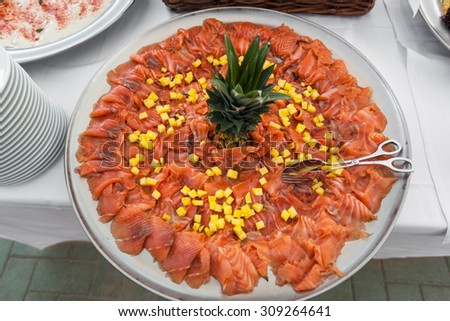 party outdoors, tasty appetizer, plate of salmon with pineapple