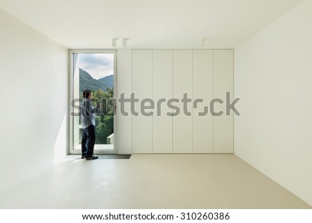 Architecture, new house interior,  room with a man inside