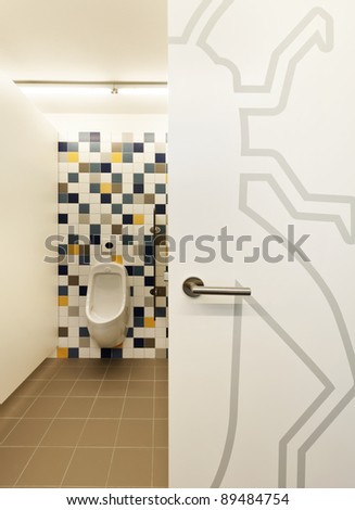 modern public school, open bathroom door of males