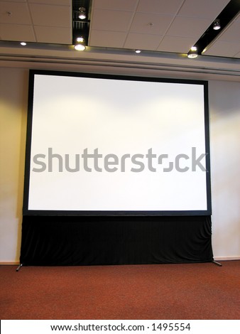 Portrait photo of blank conference room projector screen.