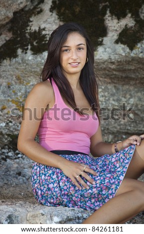 Young girl in a miniskirt in a natural place