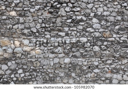 Stone wall background, dark limestone