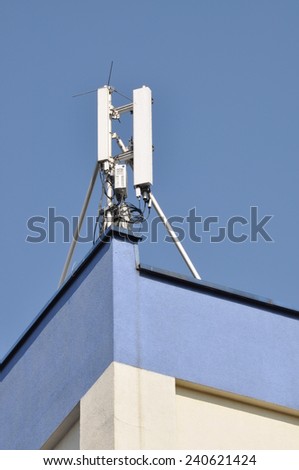 Cellular communication aerial on a building roof
