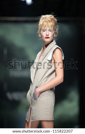 ZAGREB, CROATIA - OCTOBER 10: Fashion model wears clothes made by Marina Design on \'Fashion.hr\' show, on October 10, 2012 in Zagreb, Croatia.