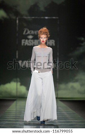 ZAGREB, CROATIA - OCTOBER 10: Fashion model wears clothes made by Marina Design on \'Fashion.hr\' show, on October 10, 2012 in Zagreb, Croatia.