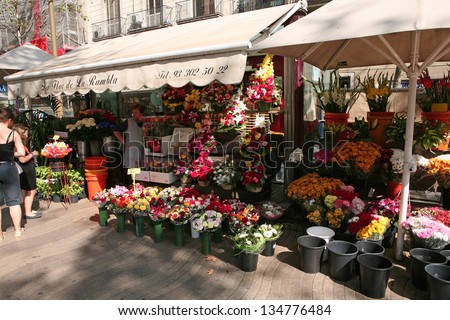BARCELONA - OCTOBER, 2: Flower stall on Barcelona street on October 2, 2009 in Barcelona, Spain. Rambla boulevard is one of the most recognized streets in the world.