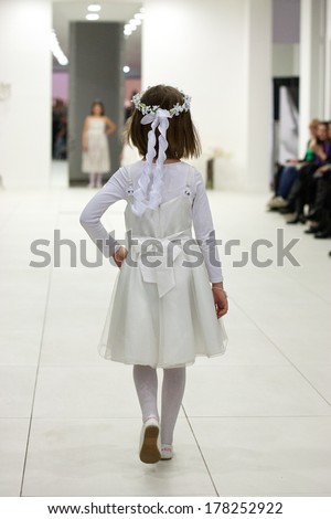 ZAGREB, CROATIA - FEBRUARY 22, 2014: Little girl in bridesmaid dress on \'Wedding expo\' show