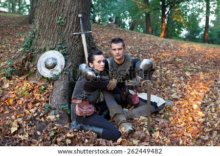 ZAGREB, CROATIA - OCTOBER 07, 2012: Woman and a man dressed in medieval clothes with swords, posing after the \