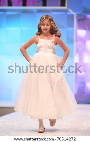 ZAGREB, CROATIA - FEBRUARY 4: Unidentified child Fashion model in bridesmaid dress on \'Wedding days\' show, February 4, 2011 in Zagreb, Croatia.