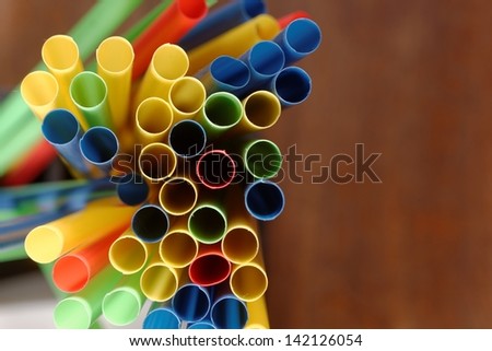 Colorful straws in a bar closeup photo