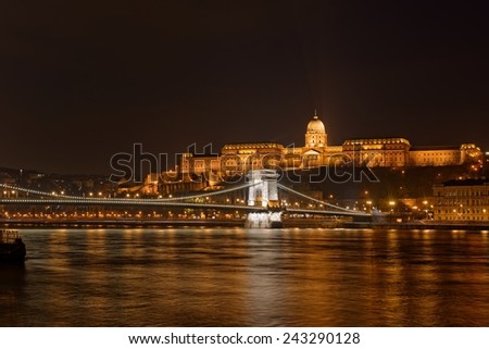 Buda Castle by the Danube river illuminated at night in Budapest, Hungary.