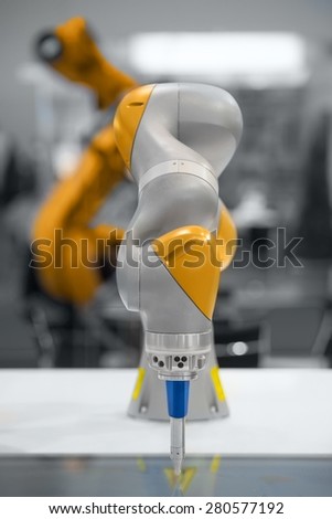High technology robotic arm closeup photo in factory
