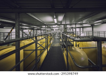 Industrial interior with welded silos from above