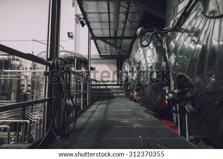 Industrial interior of an alcohol factory with silos