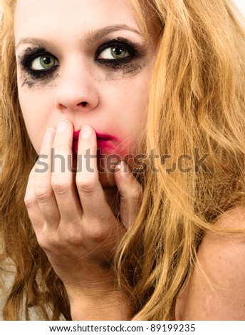 Scared girl with beautiful blond hair
