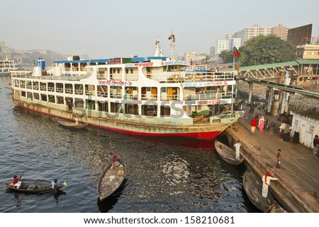 DHAKA, BANGLADESH - DECEMBER 14: A ferry is prepared for boarding at the Sadarghat Launch Terminal on December 14, 2012 in Dhaka, Bangladesh. Boat travel is deeply ingrained in Bangladeshi culture.