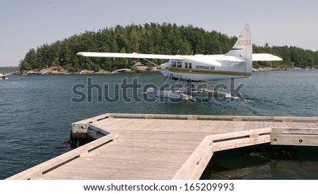 Deer Harbor, Washington - AUGUST 12: A Puget Sound seaplane taxis into the harbor, preparing for take off on August 12, 2010 in Deer Harbor, WA.