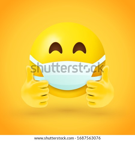 Emoji with mouth mask and thumbs up - yellow face with half-closed eyes wearing a white surgical mask with both hands in thumbs up position
