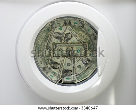 Money Laundry - a washing machine with dollars inside