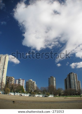 Wide Angle shot of the beach and sky in English Bay, Vancouver
