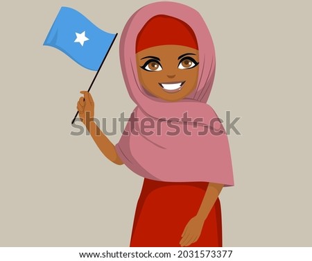 Black African Somalian woman holding and waving Somalia flag