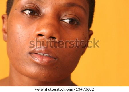 Simple head shot of pretty ethnic lady with her head turned