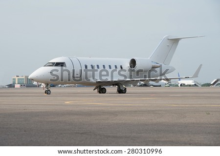 Business jet airplane on the ground.