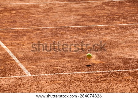 Tennis balls on the clay court.