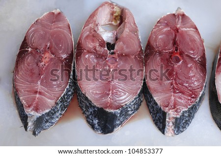 Three slices of raw catfish