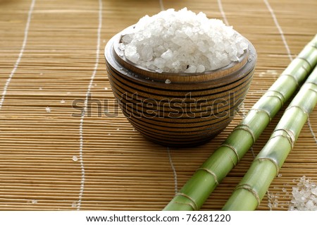 herbal salt with green lucky bamboo on mat