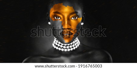 an africa symbol image on the beautiful african face of a young 