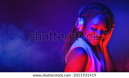 Similar – Image, Stock Photo Woman model with headphones around the neck