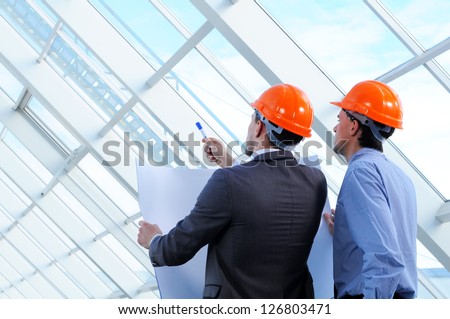 Two men in hard hats at construction site