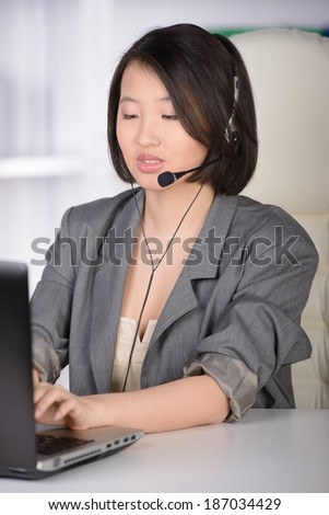 Call Center. Business woman Asia, working in the office