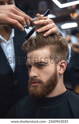 Similar – Foto Bild Friseur in einem Friseursalon