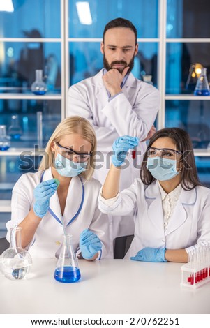 Laboratory, chemistry and science concept. Science team working in a laboratory.