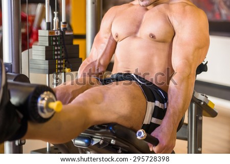 Athlete leg muscles. Quadriceps working out. Caucasian muscular sportsman.
