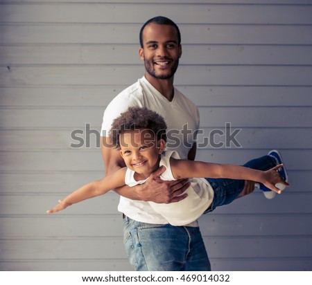 Similar – Image, Stock Photo Ethnic father playing with child on ground