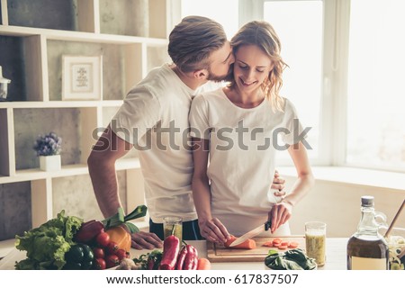 Similar – Image, Stock Photo Couple kissing in kitchen on counter