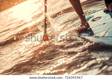 Similar – Image, Stock Photo Crop surfer on board in sea water