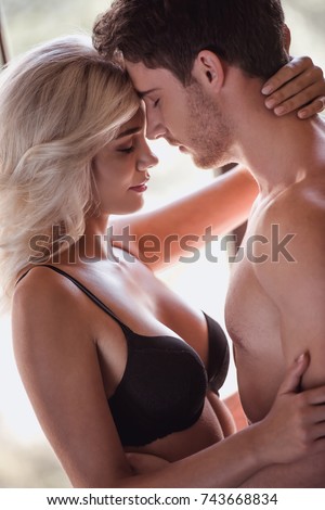 Young men kissing and having sex