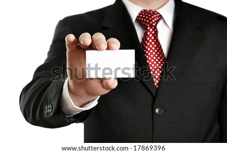 Businessman showing his business card, focus on fingers and card.