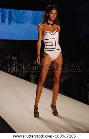 MIAMI - JULY 21: Model walks runway at the XTRA Life Lycra Brand Collection for Spring/ Summer 2013 during Mercedes-Benz Swim Fashion Week on July 21, 2012 in Miami, FL