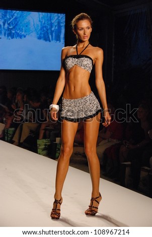 MIAMI - JULY 21: Model walks runway at the XTRA Life Lycra Brand Collection for Spring/ Summer 2013 during Mercedes-Benz Swim Fashion Week on July 21, 2012 in Miami, FL