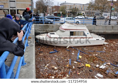 BROOKLYN, NY - OCTOBER 30: Debris litters the water in the Sheapsheadbay neighborhood due to flooding from Hurricane Sandy in Brooklyn, New York, U.S., on Tuesday, October 30, 2012.