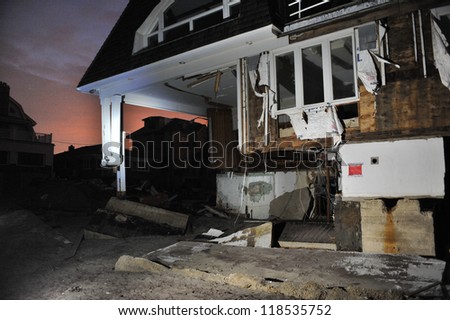 QUEENS, NY - NOVEMBER 11: Damaged houses without power at night in the Rockaway beach - Bel Harbor area due to impact from Hurricane Sandy in Queens, New York, U.S., on November 11, 2012.